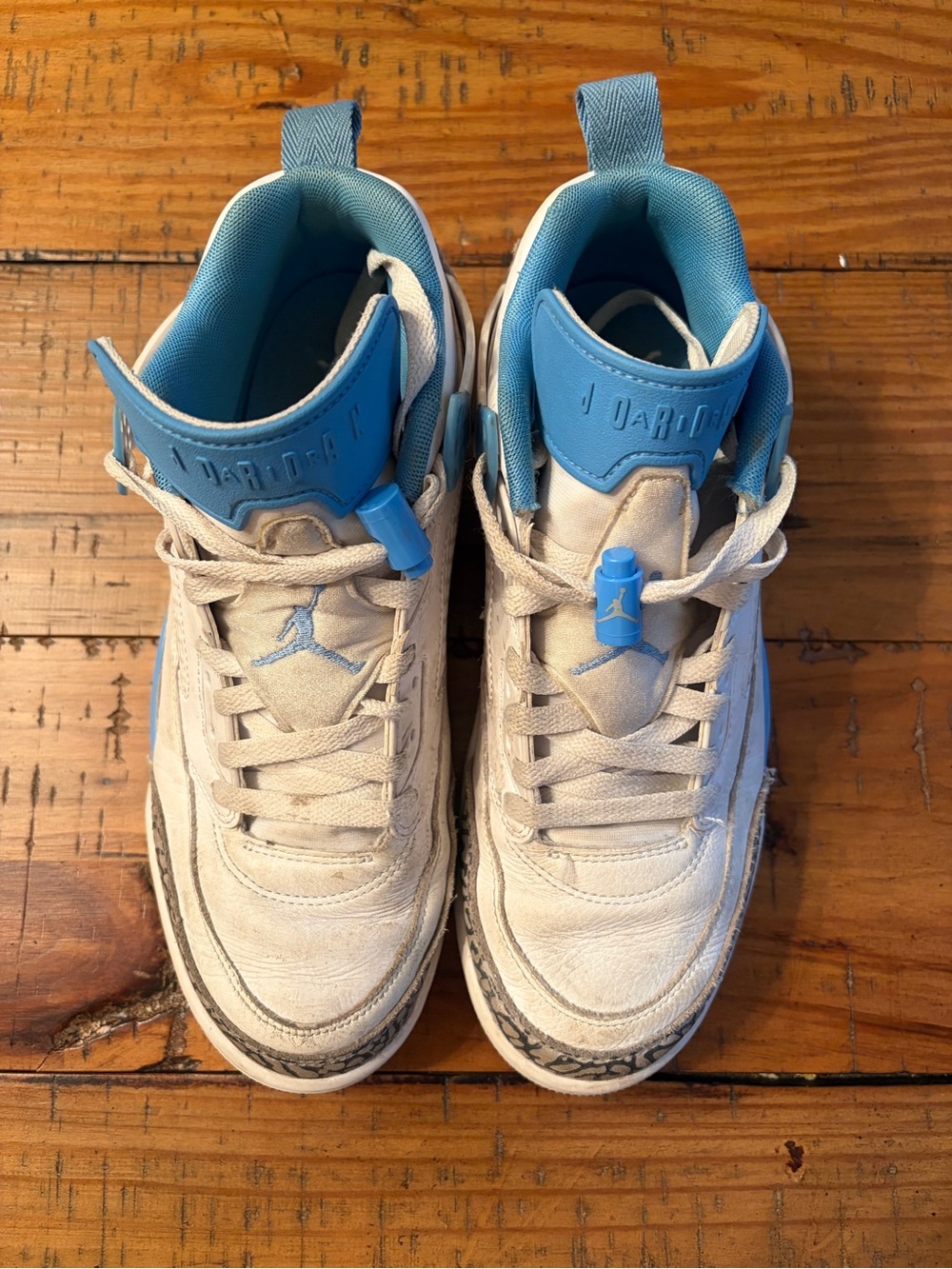 Jordan Men’s White and Carolina Blue Retro Sneakers